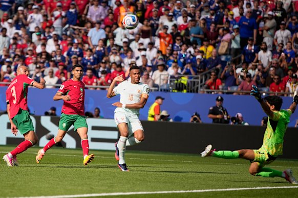 Kylian Mbappe attempts a shot at goal and fails to score.