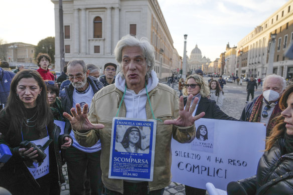 Pietro Orlandi wears a placard with a picture of his sister Emanuela during a sit-in near Saint Peter’s Basilica in Rome.