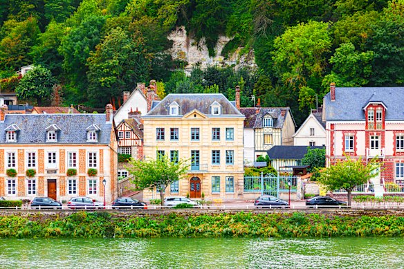 The historic village of La Bouille, nestled along a bend of the Seine River just southwest of Rouen.