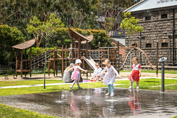 Children play at a playground at the former Pentridge Prison site, which is now a housing development.