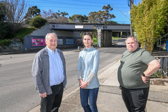 Doug Klein, Bayside City Council mayor Fiona Stitfold, and Derek Screen, stand on the side of Bay Road, which has two competing visions for its future.