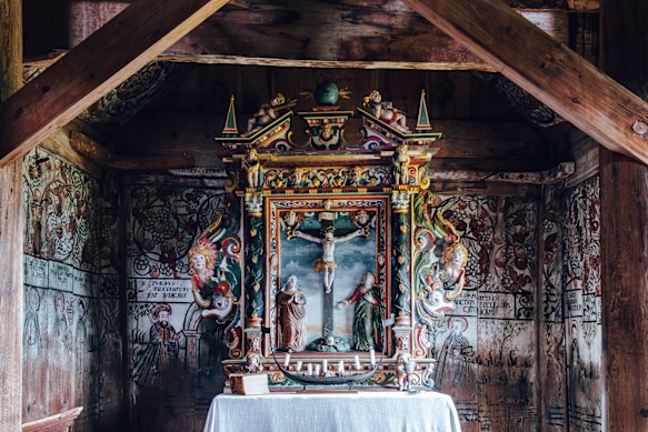 A wooden altar inside the historic Urnes Stave Church, built in the early 12th century.