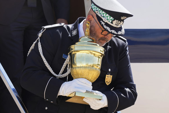 A Portuguese military officer disembarks a plane carrying a reliquary containing the heart of Brazil’s former emperor Dom Pedro I as it is given a military honours ceremony at the air base in Brasilia, Brazil