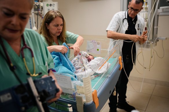 Medical staff transfer patients to a protected underground facility following an Iranian missile attack, at Ichilov Hospital in Tel Aviv.