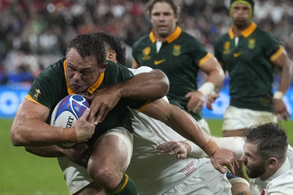 South Africa’s Deon Fourie is tackled by England during their semi-final.