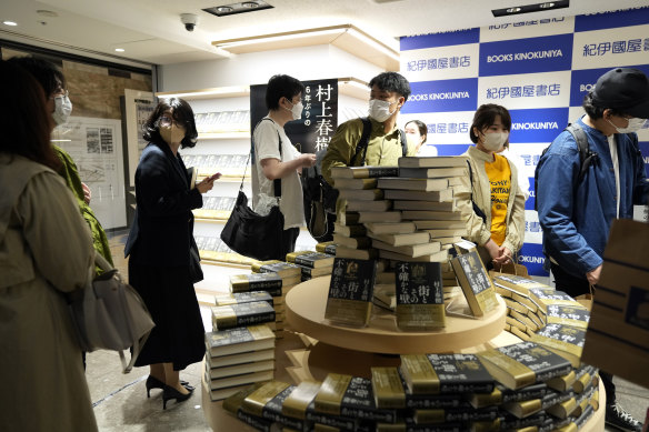 Customers line up to buy Haruki Murakami’s new novel The City and Its Uncertain Walls on the day of its release.