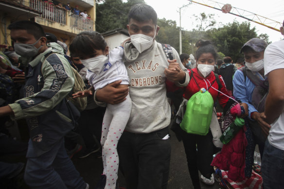 Honduran migrants hoping to reach the US cross the border patrolled by Guatemalan soldiers, in El Florido, Guatemala on Saturday.