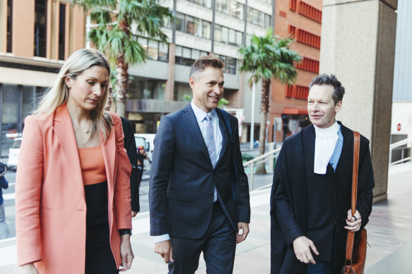 The Project producer Angus Llewellyn, centre, with solicitor Marlia Saunders and barrister Matt Collins, KC, outside the Federal Court in Sydney on Tuesday.