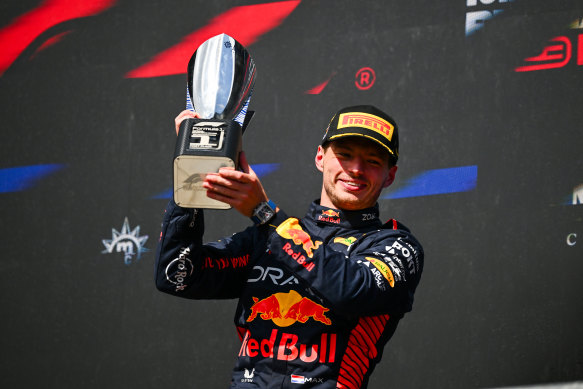 Race winner Max Verstappen of the Netherlands celebrates on the podium. 