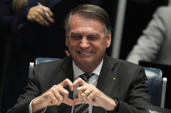Brazilian President Jair Bolsonaro, who is running for a second term, make a heart hand gesture in Congress last week.
