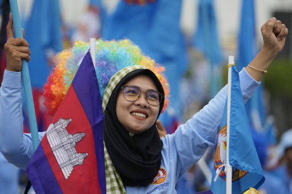 A supporter of the Cambodian People’s Party participates in a procession in Phnom Penh.