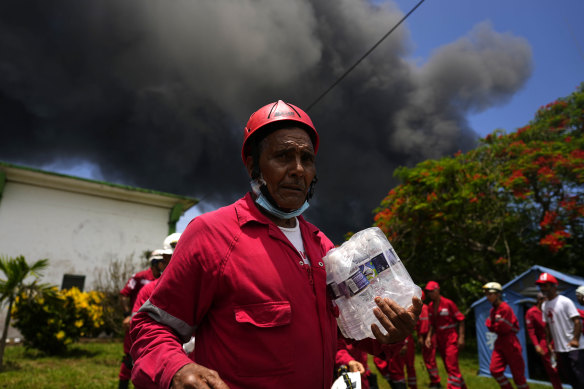 Members of the Cuban Red Cross prepare to be transported to the Matanzas Supertanker Base.