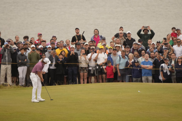 Cameron Smith putts on the 11th green for a birdie in the final round.