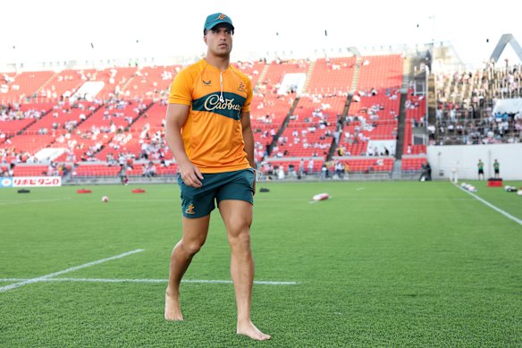 Joseph-Aukuso Suaalii of Australia inspects the pitch.