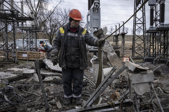 Workers repair infrastructure in a power plant that was damaged by a Russian air attack in Kyiv Oblast, Ukraine. Drone strikes are causing electricity and heating outages across Ukraine.