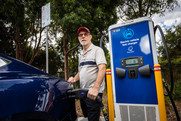 Mark Balkin charging his car at a public EV charging station. 