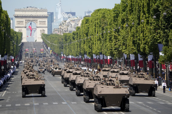 Military vehicles on the Champs-Elysees for Bastille Day.