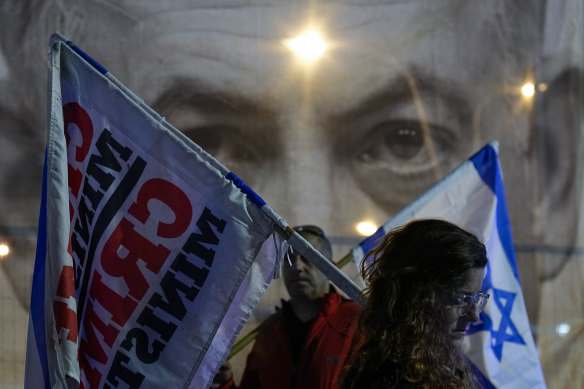 Israelis stand still to observe a moment of silence for victims of a shooting attack in Jerusalem in which seven Israelis were killed by a Palestinian gunman.