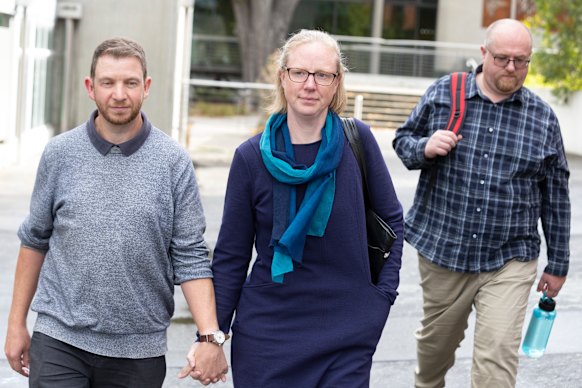 Siblings Anna-Marie Terrington (centre) and Matthew Patterson (right) outside court. 