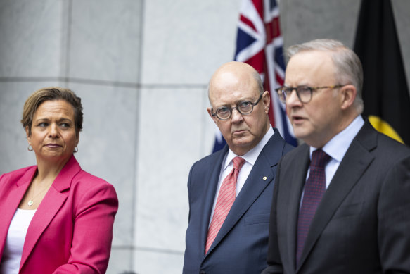 Kim Williams (centre) with Minister for Communications Michelle Rowland and Prime Minister Anthony Albanese  at the announcement of his appointment in January.