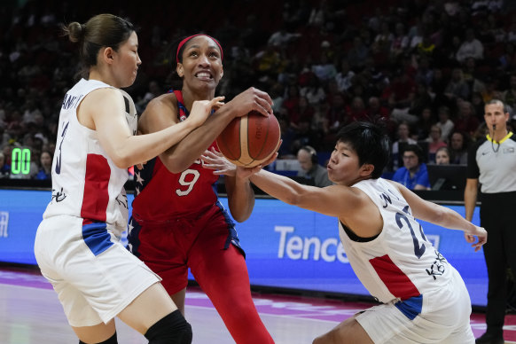 The USA’s A’ja Wilson (centre) comes in for plenty of attention against Korea.
