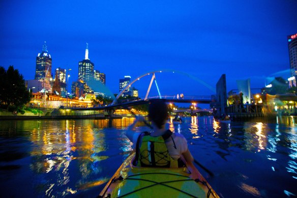 Paddling at night with Kayak Melbourne. 