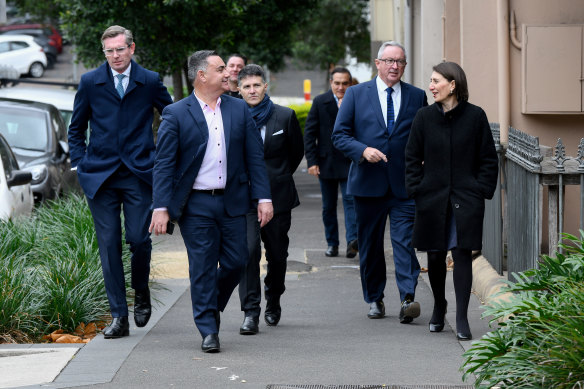 Premier Gladys Berejiklian leads her team to a press conference on allowing 50 patrons at cafes, pubs and restaurants.