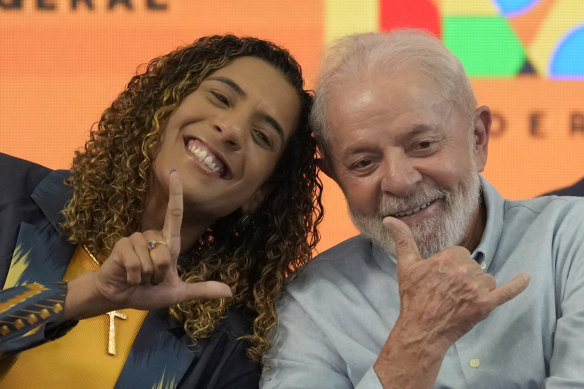 Brazil’s Minister of Racial Equality Anielle Franco, the sister of slain councilwoman Marielle Franco, flashes an “L” finger sign as she poses for a photo with Brazil’s President Luiz Inácio Lula da Silva las week.