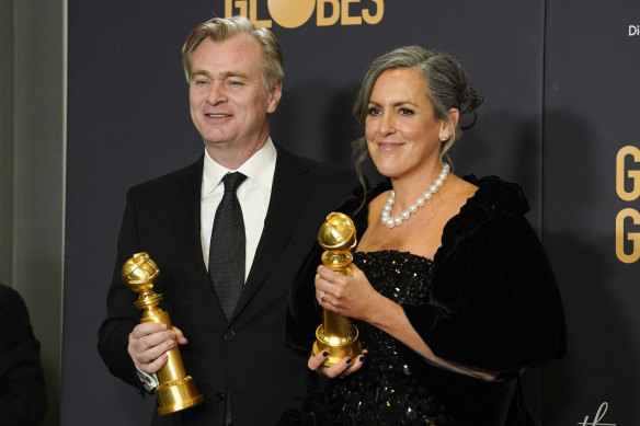 Plenty more where they came from! Christopher Nolan, left, and Emma Thomas with their Golden Globes.