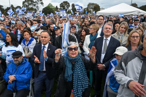 Federal Attorney-General Mark Dreyfus, Victorian Premier Jacinta Allan and state Opposition Leader John Pesutto with the crowd at the vigil on Friday.