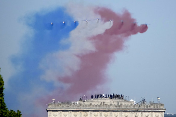 Alphajets of the Patrouille de France fly over the Arc de Triomphe and the Champs-Élysées in Paris during the Bastille Day parade on July 14.