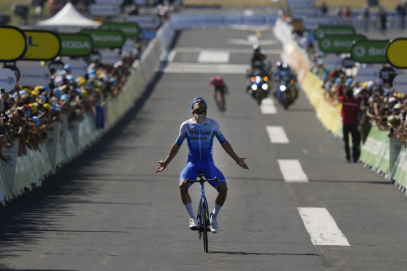 Stage winner Michael Matthews celebrates as he crosses the finish line. 