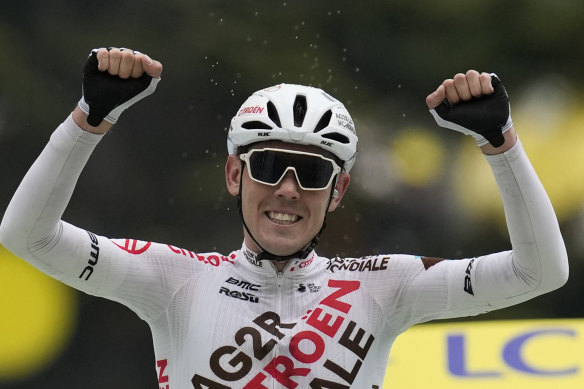 Australia’s Ben O’Connor celebrates as he crosses the finish line to win the ninth stage.
