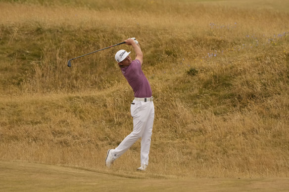 Cameron Smith hits his ball out of the rough on the 5th fairway.