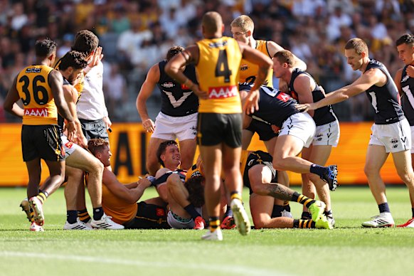 Zak Butters of Victoria and Luke Jackson of Western Australia wrestle.