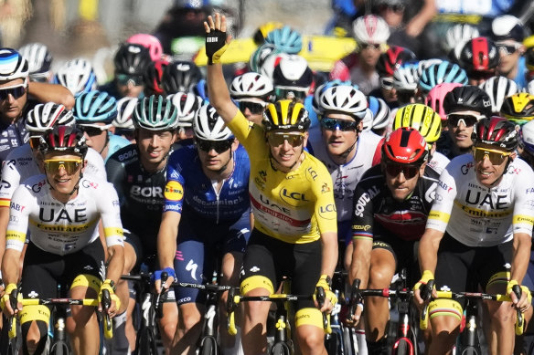 Reigning Tour de France champion Tadej Pogacar, centre, is again the man to beat this year. 