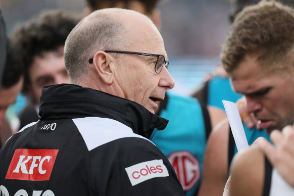 Power coach Ken Hinkley address his players on Saturday.
