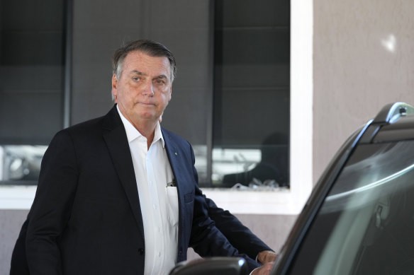 Former Brazilian president Jair Bolsonaro outside his home in Brasilia earlier this month after Federal Police agents carried out a search of it.