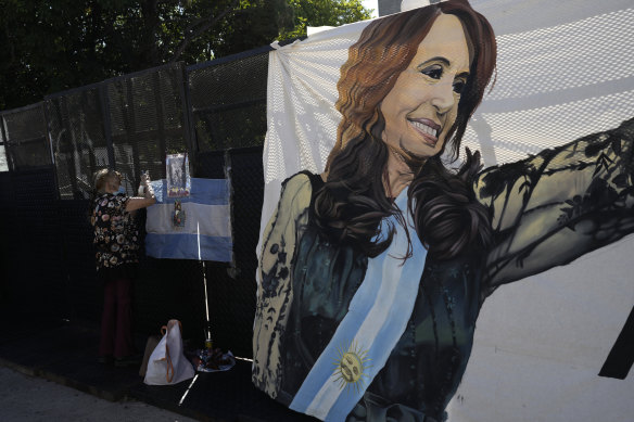 Supporters of Argentinian Vice President Cristina Fernandez de Kirchner wait for the verdict outside court on Tuesday.