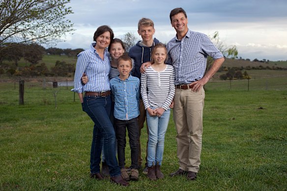 Angus Taylor posed with his family (left to right) Louise Clegg and children Olivia, Richard, Hamish and Adelaide on the family farm in Goulburn in 2014.