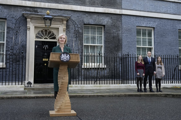 Former prime minister Liz Truss speaks outside Downing Street supported by her family.