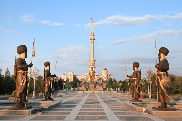 The Independence Monument in Ashgabat is flanked by statues that celebrate Turkmenistan’s sovereignty.