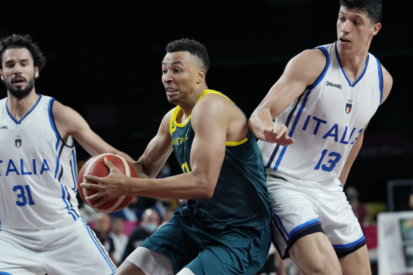 Australia’s Dante Exum drives forward against Italy.