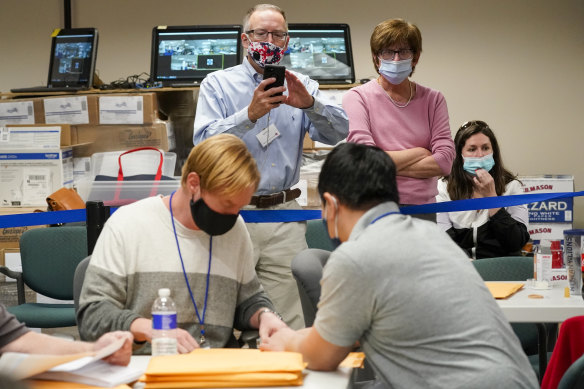 Republican and Democrat observers at work as the ballots were counted in Allentown, Pennsylvania. 