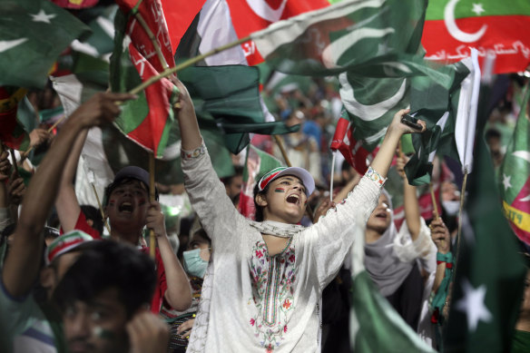 Supporters of Pakistani opposition leader Imran Khan’s Tehreek-e-Insaf party attend a rally o press government for fresh elections, in Lahore on August 13.
