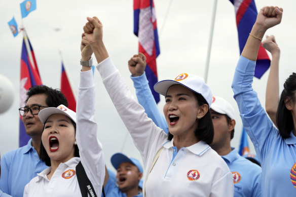 Cambodian People’s Party backers take to the streets of the capital on Friday.