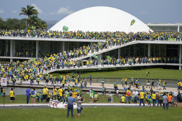 Protesters, supporters of Brazil’s former president Jair Bolsonaro, storm the National Congress building in Brasilia, Brazil, on January 8. 