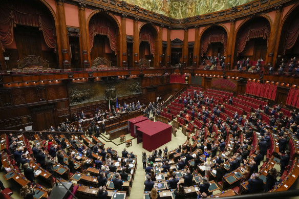 Lawmakers clap after Sergio Mattarella is re-elected as Italy’s 13th president.