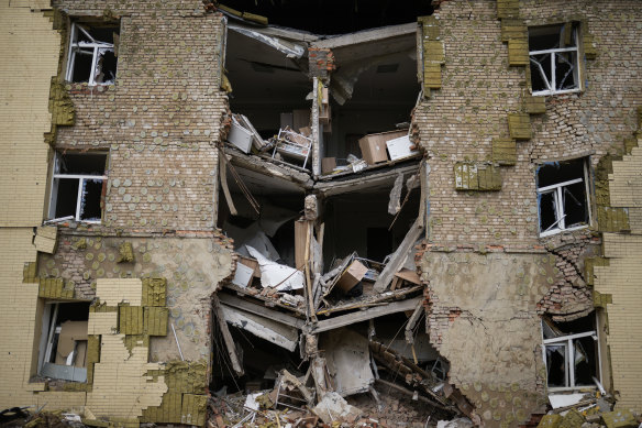 Debris hangs from a residential building heavily damaged in a Russian bombing in Bakhmut, eastern Ukraine.