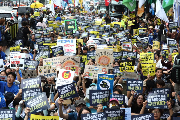 Korean protesters participate in a rally against the Japanese government’s plan to dump radioactive wastewater from the damaged Fukushima nuclear power plant into the Pacific Ocean, in Seoul, last week.